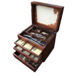 A Victorian mahogany travelling dentists cabinet with hinged box above five graduated drawers, the