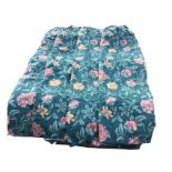 Two pairs of floral cotton curtains printed with pink and orange flowers on green ground, with