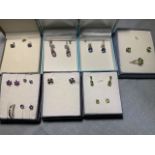 Seven pairs of silver stud earrings, three pairs of drop earrings, and two silver rings - all set
