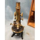 A cased late Victorian microscope by Ernst Leitz Wetzlar, the instrument with spare lenses and