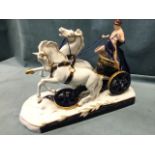A Royal Dux porcelain model of a roman chariot with figure in carriage led by a pair of horses,