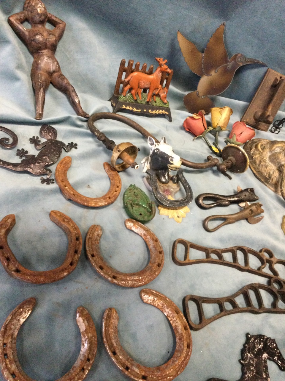 Miscellaneous metalware including four lionmask door knockers, a cast iron figure, horseshoes, pegs, - Image 3 of 3