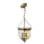 A contemporary mottled glass and brass hall lantern, with bowl shaped enclosure around twin lamps on