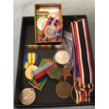 A box of miscellaneous general service medals, a collection of medal ribbons, a crown, etc. (A lot)