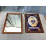 A Heilemans lager advertising mirror in moulded frame; and an oak framed rectangular mirror. (2)