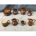 A small collection of Victorian copper lustre - six jugs, a handpainted tankard and a blue resist