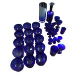 A quantity of Bristol blue type glass including a set of 15 dessert bowls, a tubular vase,