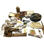 Miscellaneous items including a 1933 tin with miscellaneous fountain pens, cutlery, a brass clock, a