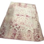 A contemporary hand tufted Indian wool rug, the pastel pink floral pattern with borders on cream