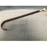 A Swaine & Adney riding crop with hallmarked silver collar and horn handle, the plaited leather cane
