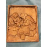Armi Könni, a carved mahogany panel depicting seated fish filliters, signed to verso & dated