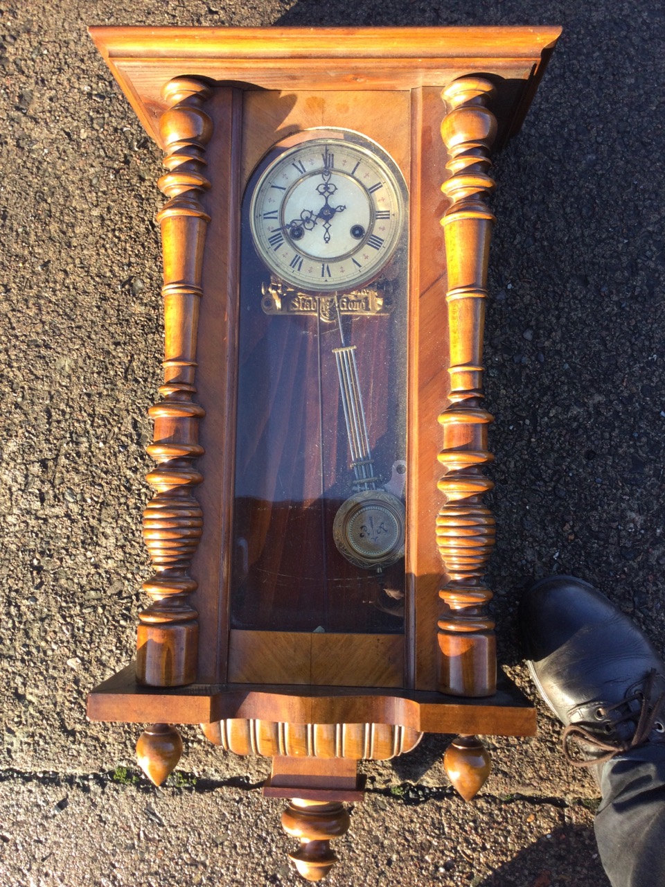 A Victorian walnut cased Vienna wallclock with moulded cornice above an arched glazed door flanked - Image 2 of 3