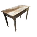 A rectangular Victorian pine table with knobbed frieze drawer raised on turned legs. (21.25in x 45in