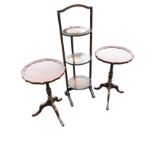 A folding oak cakestand with three circular platforms in square frame with arched handle; and a pair