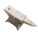 A cast iron anvil, the rectangular working block with tapering point on waisted stand. (24.75in)