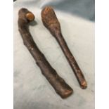 A Victorian Irish shillelagh type hardwood club, the bark covered mace pieced for thong; and another