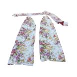 A pair of Schumacher printed floral cotton curtains with narcissus and primroses on ivory ground,