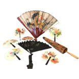 A Japanese handpainted paper & cane parasol; and eight miscellaneous fans. (9)