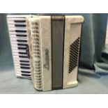 A Luciano Italian accordion with lustre pearline body and silvered bellows. (16.5in x 7.25in x 16.