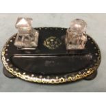 A Victorian papiémaché desk tidy by Jennens & Bettridge, the oval inkstand with associated glass