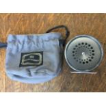 A Hardy perfect trout fly reel with dished drum, agate ring and brass rim adjust screw, in cloth