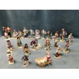 A large collection of Meissen and Sitzendorf style European porcelain figurines, mainly on gilt