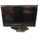 A large Toshiba flatscreen TV with remote - working. (35.25in x 25.5in)