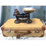 A 1931 army suitcase with leather mounts; and a set of cast iron scales & weights with tin