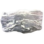 A shaped variegated marble slab, polished to one side. (40.75in x 23.5in)