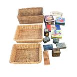 Three rectangular cane baskets; a collection of C20th tins including 1935 commemorative, biscuit