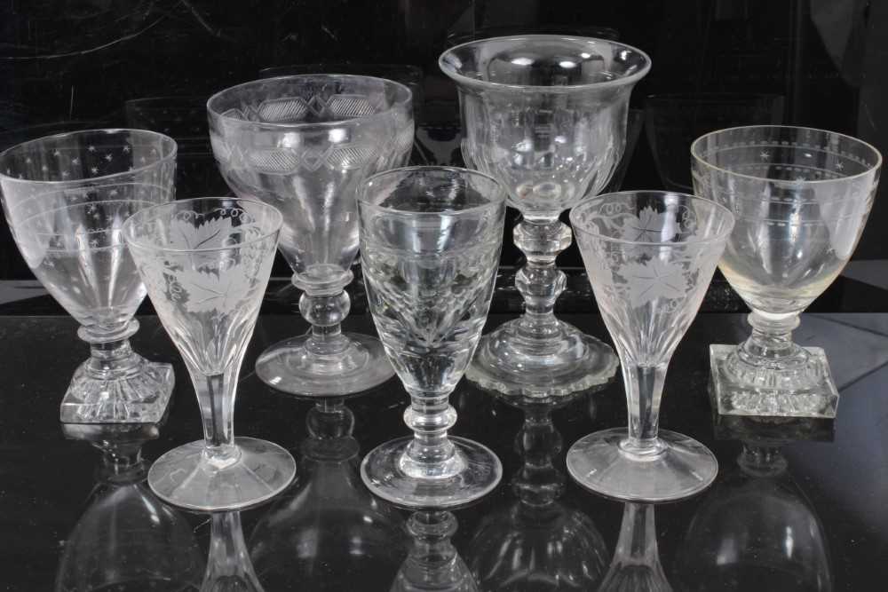 Group of 18th and 19th century English glassware, including a cut glass goblet, two goblets with lem