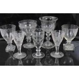 Group of 18th and 19th century English glassware, including a cut glass goblet, two goblets with lem