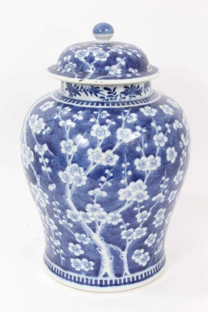 Large antique 19th century Chinese blue and white porcelain ginger jar and cover, painted with prunu