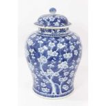 Large antique 19th century Chinese blue and white porcelain ginger jar and cover, painted with prunu