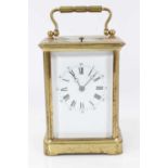 Late Victorian repeating carriage clock with enamel dial, striking on gong in gilt brass case 17cm h