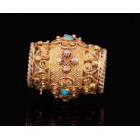 Regency gold and turquoise slide, of barrel shape, the gold cannetille and filigree decoration with