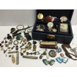 Vintage leather jewellery box containing a selection of antique and vintage jewellery and costume je