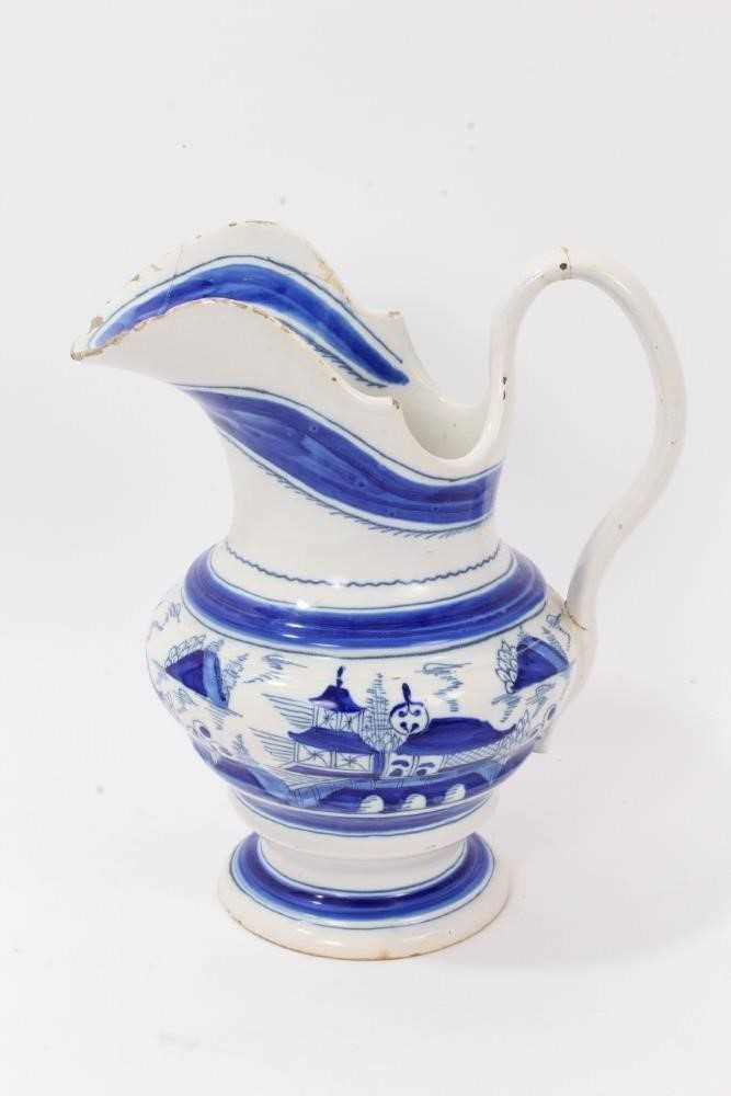 19th Century tin glazed pottery jug with blue and white chinoiserie decoration