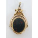 Unusual late Victorian gold/yellow metal and agate revolving fob with concealed locket compartment,