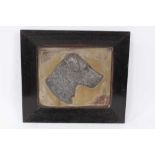 Early 20th century pewter relief plaque of a terrier, mounted in ebonised oak frame