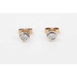 Pair of diamond stud earrings, each with a round brilliant cut diamond weighing approximately 0.05ct