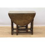 Late 17th century oak oval gateleg dining table with end drawer on bobbin turned legs