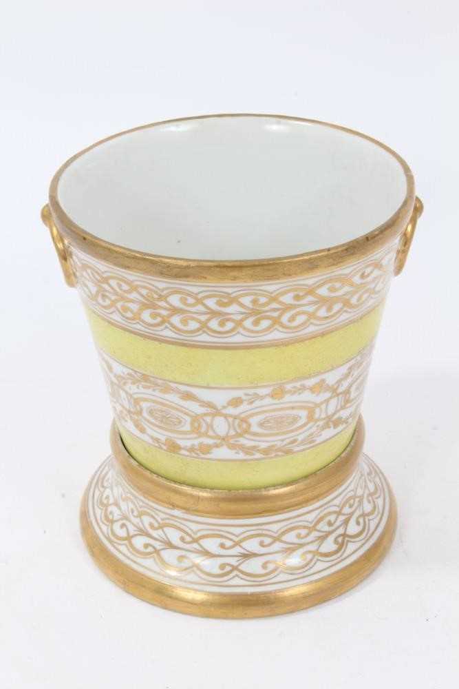 A Coalport yellow ground jardinière and stand, circa 1800-15