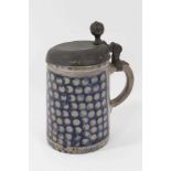 An 18th Century Westerwald stoneware tankard, with hinged pewter cover
