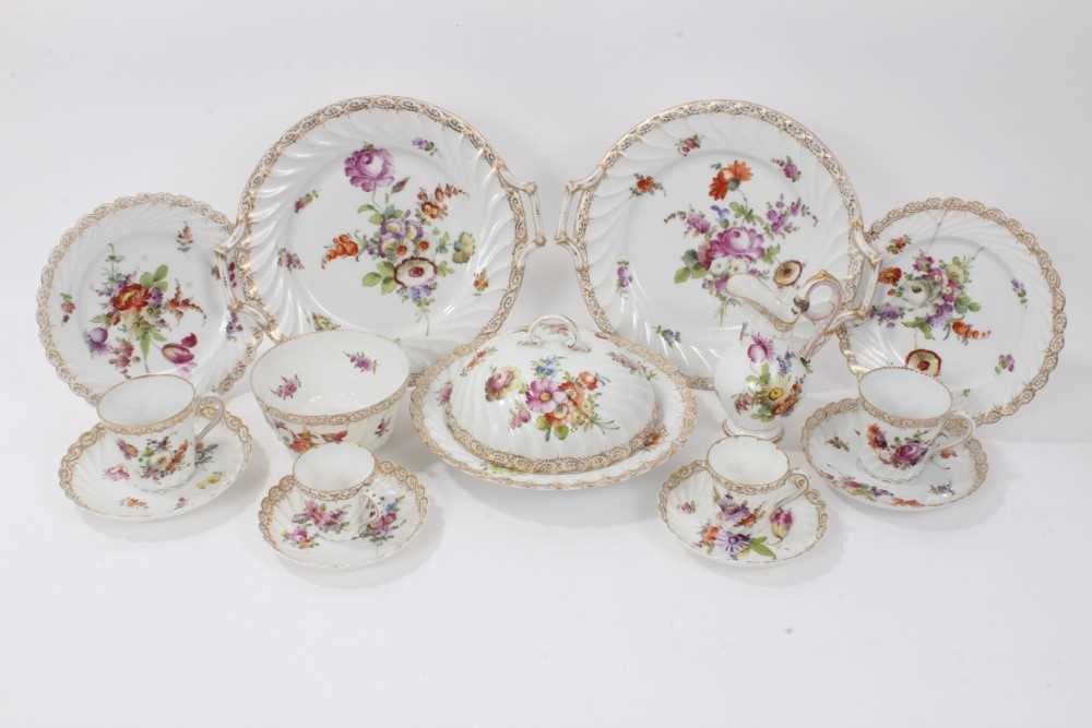 Dresden china tea service, c.1920, of fluted form, painted with floral sprays, including ten coffee