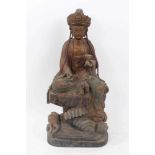 Antique Chinese carved wood figure of a seated Deity with marks to rear
