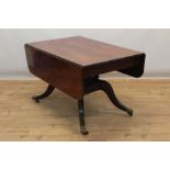 Regency style mahogany extending pedestal dining table