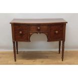 Early 19th century mahogany bowfront sideboard or dressing table of small size.