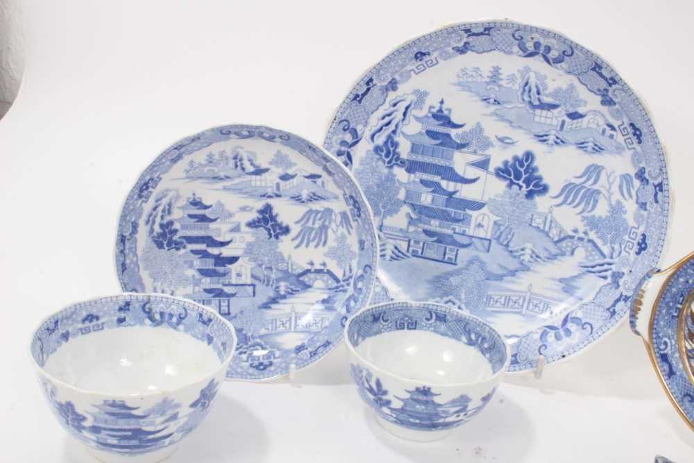 A Miles Mason blue printed teapot stand, impressed mark, and other blue printed items