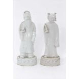 Good pair of antique Chinese Qing period blanc de chine figures, the female figure carrying a fly wh